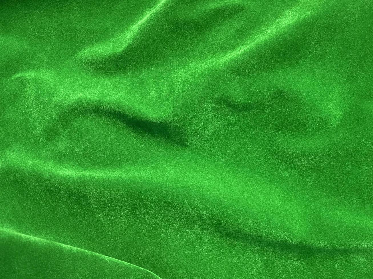 Dark green old velvet fabric texture used as background. Empty green fabric background of soft and smooth textile material. There is space for text.. photo
