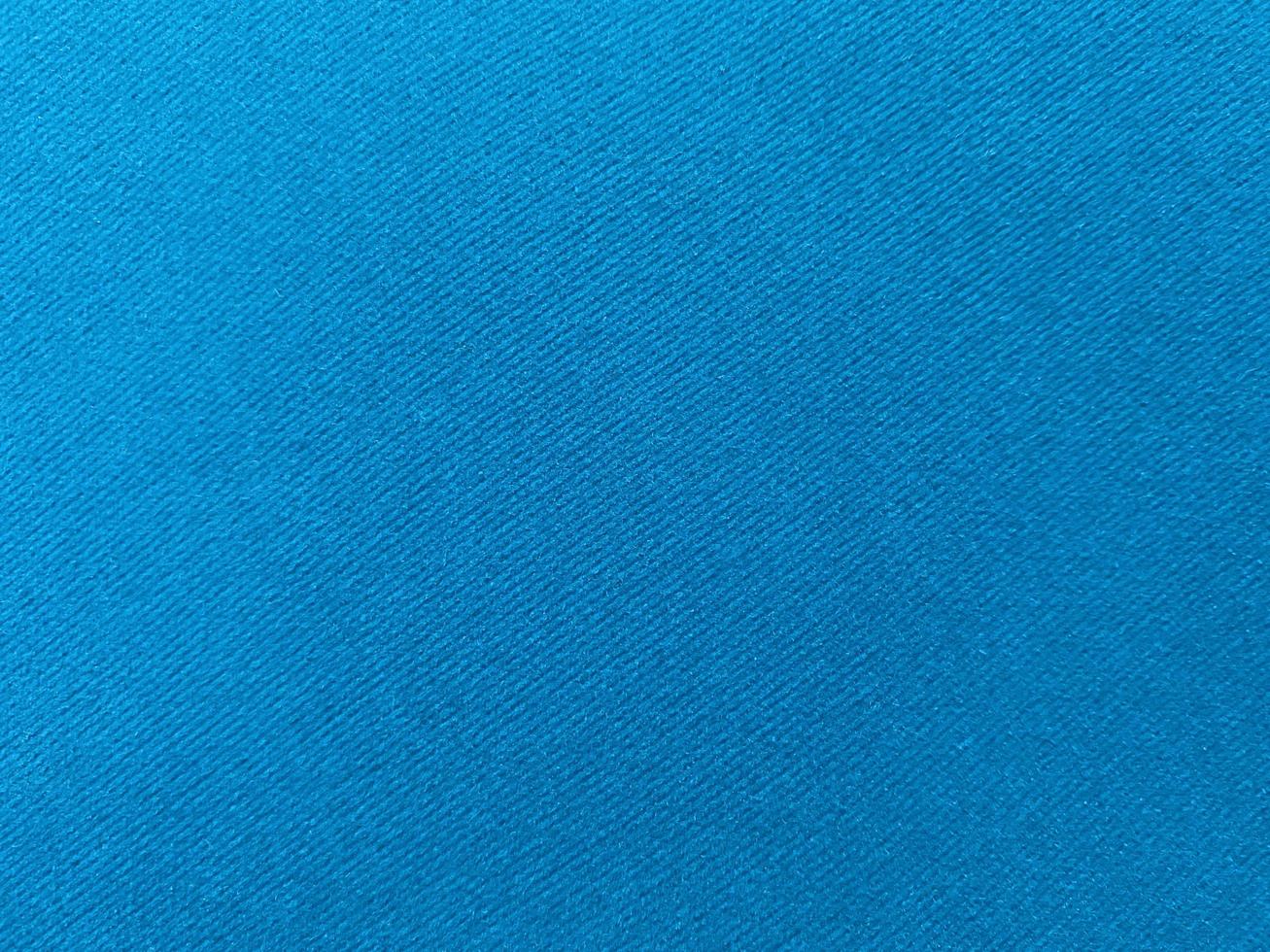 Light blue velvet fabric texture used as background. Empty blue fabric background of soft and smooth textile material. There is space for text... photo