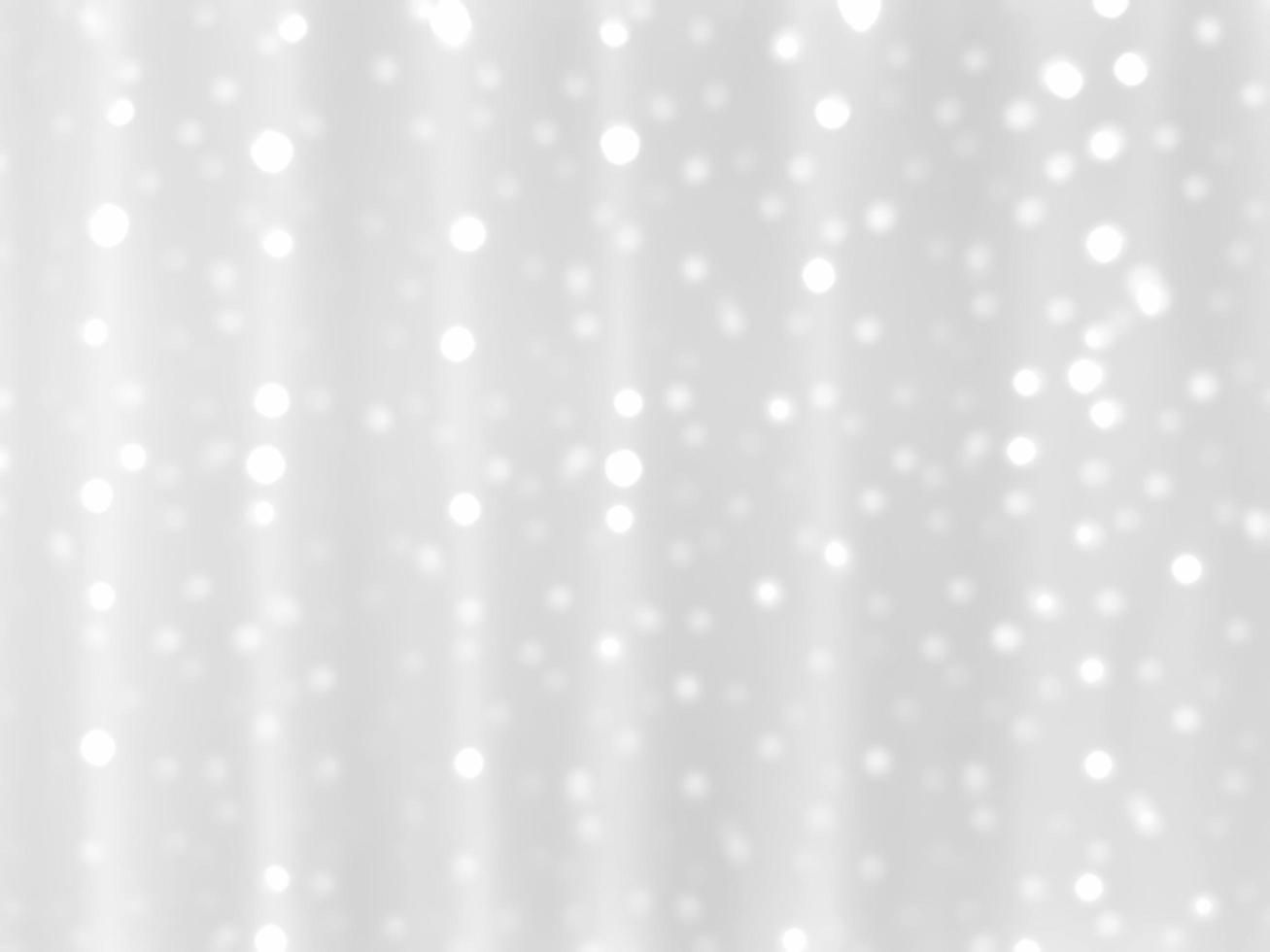 Abstract white blurred bokeh light on soft light background.In concept Christmas or New Year holiday card template. Magic falling snow backdrop. photo