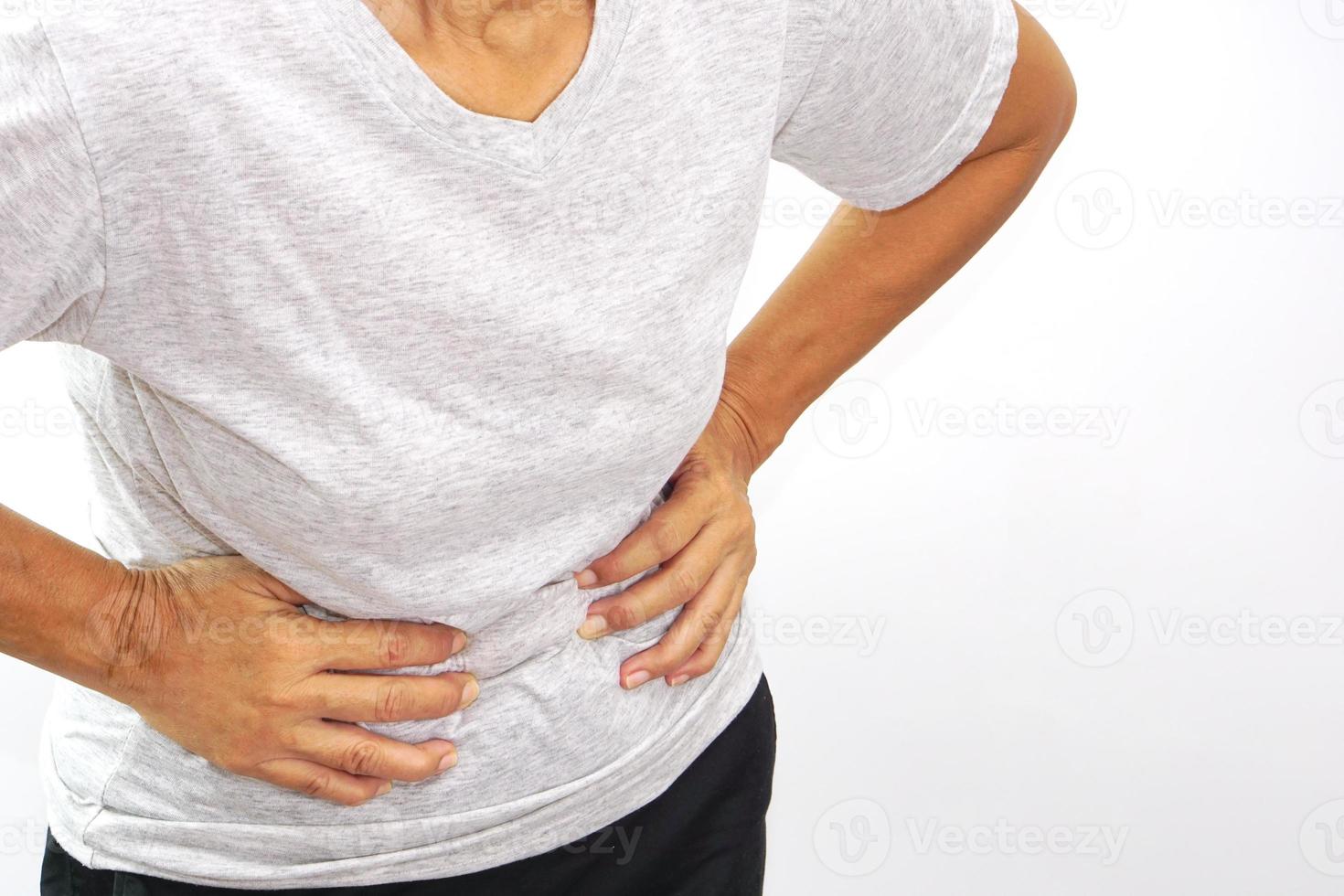 Asian woman suffering from stomachache. Chronic gastritis, menstruation and health concept. photo