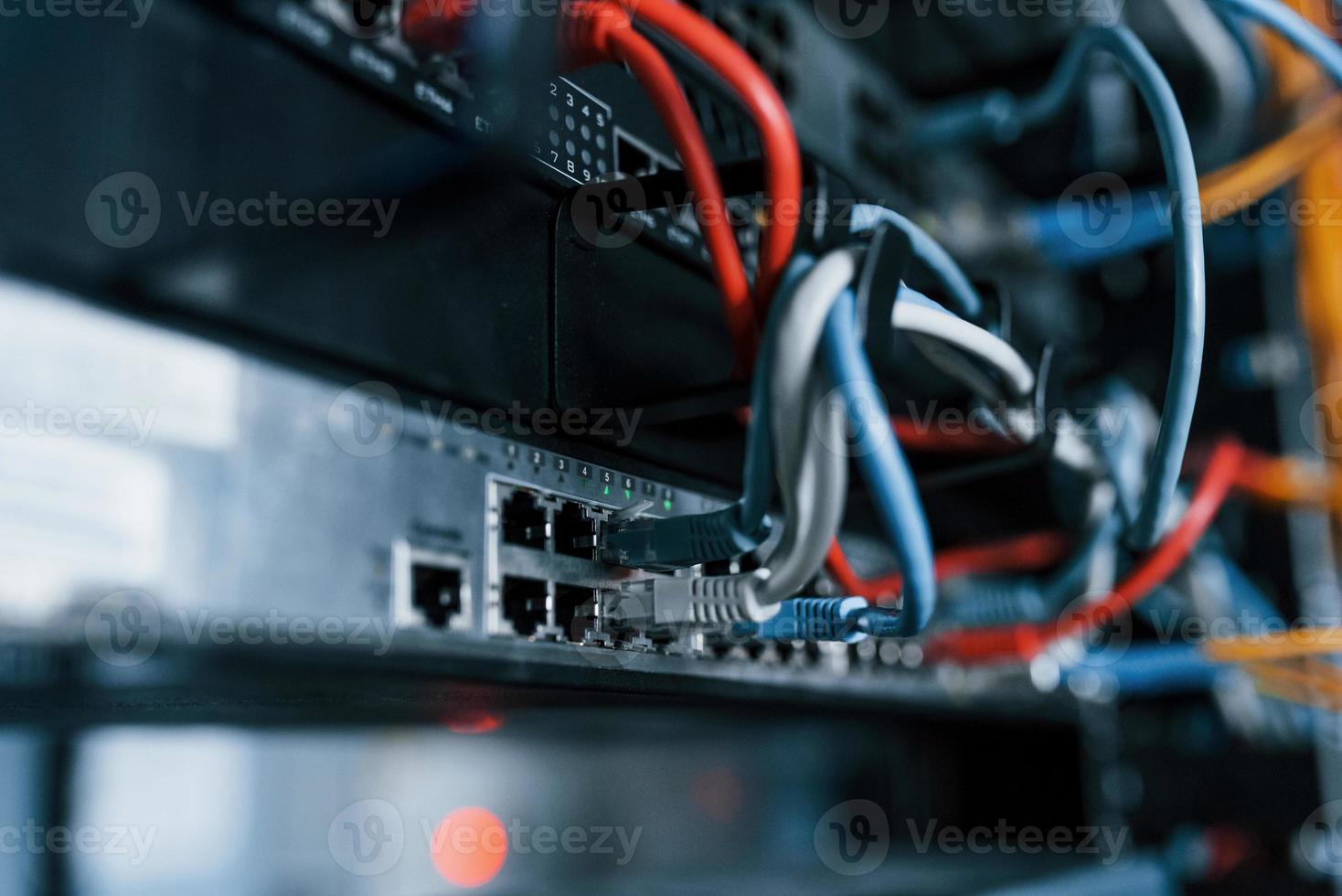 Close up view of internet equipment and cables in the server room photo