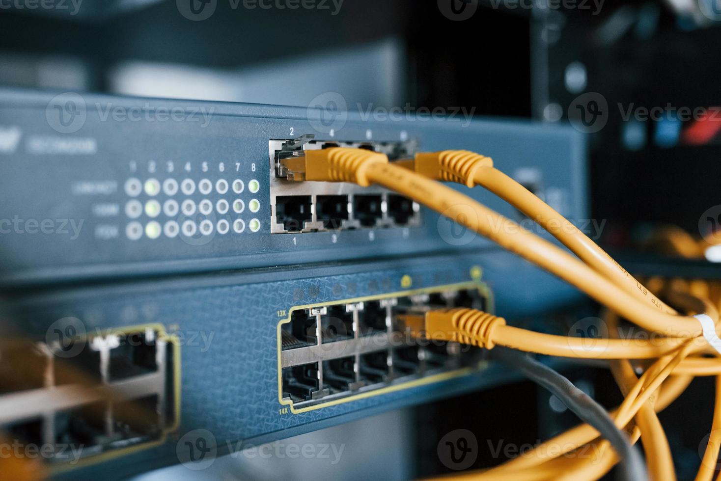 Close up view of internet equipment and cables in the server room photo