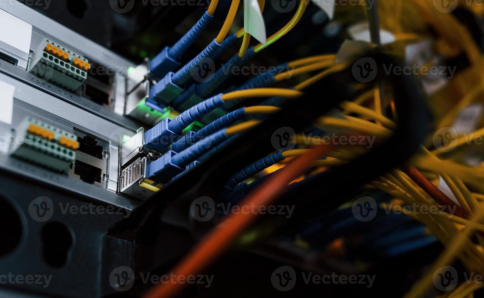 Close up view of internet equipment and cables in the server room photo