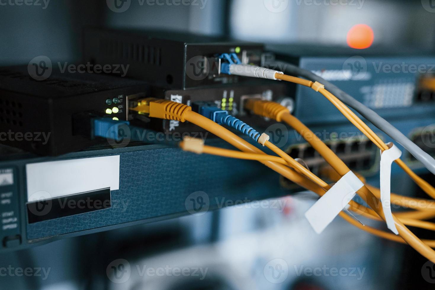 Close up view of internet equipment and cables in the server room photo