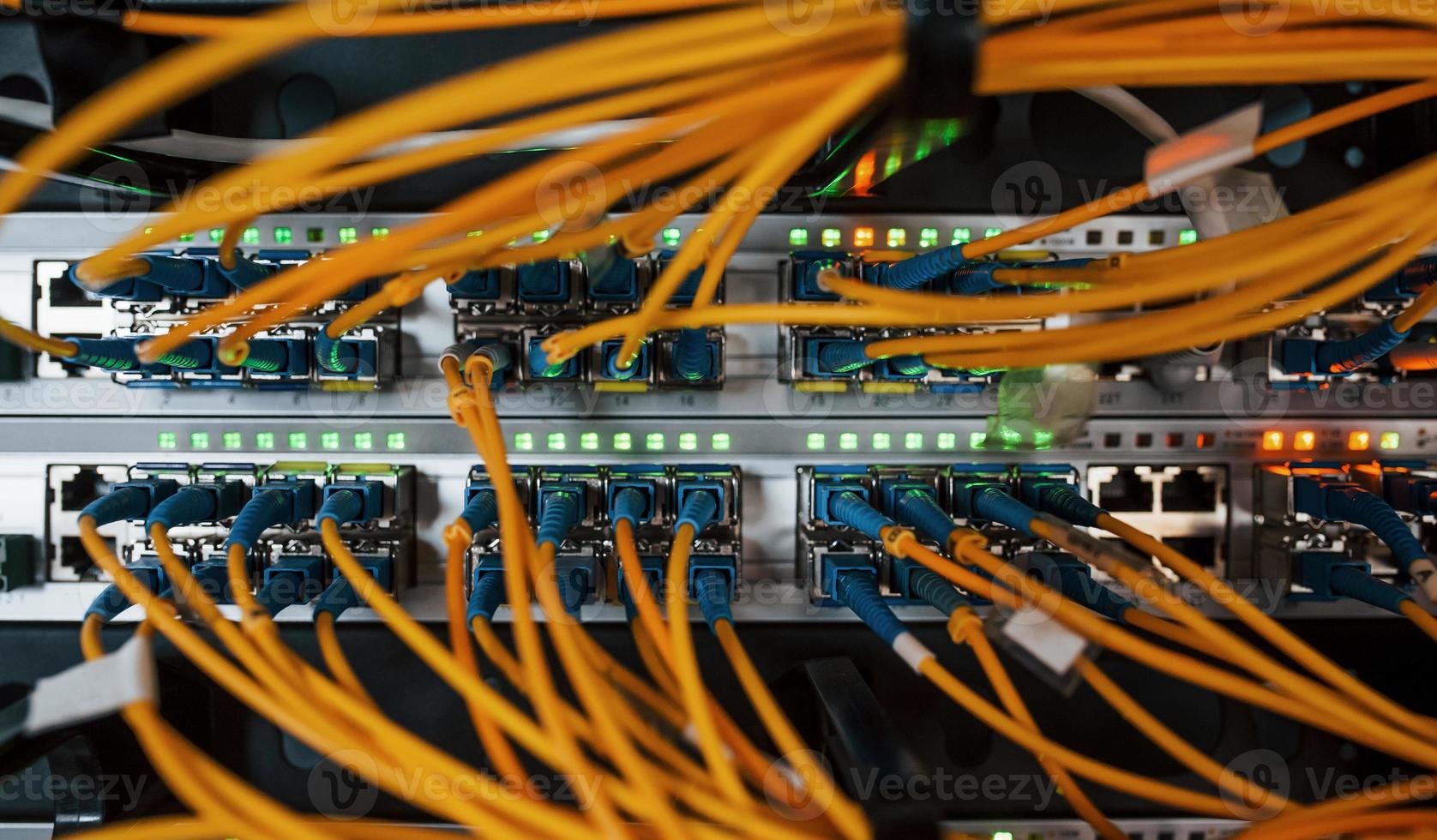 Close up view of internet equipment and cables in the server room photo