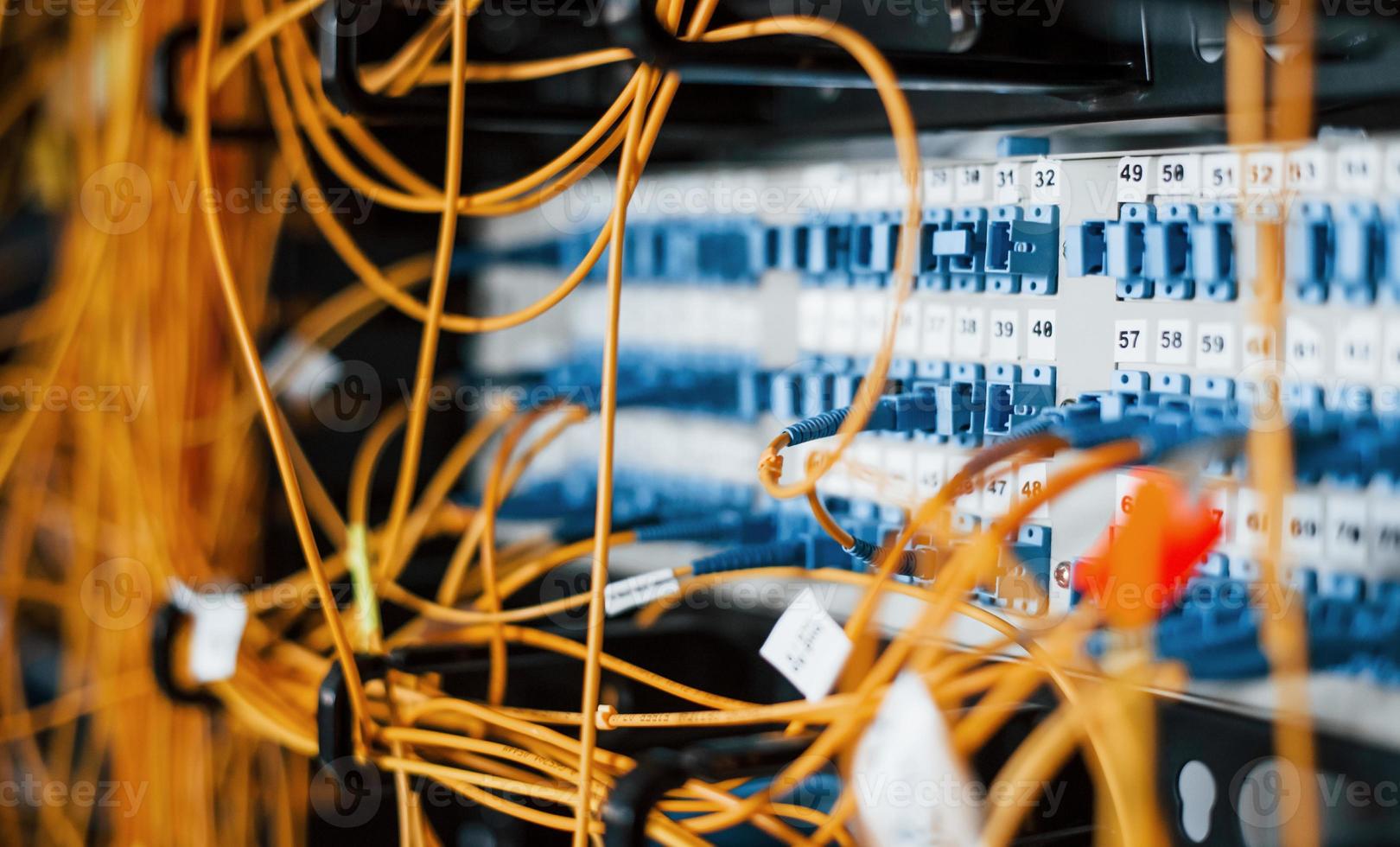 Close up view of internet equipment and cables in the server room photo