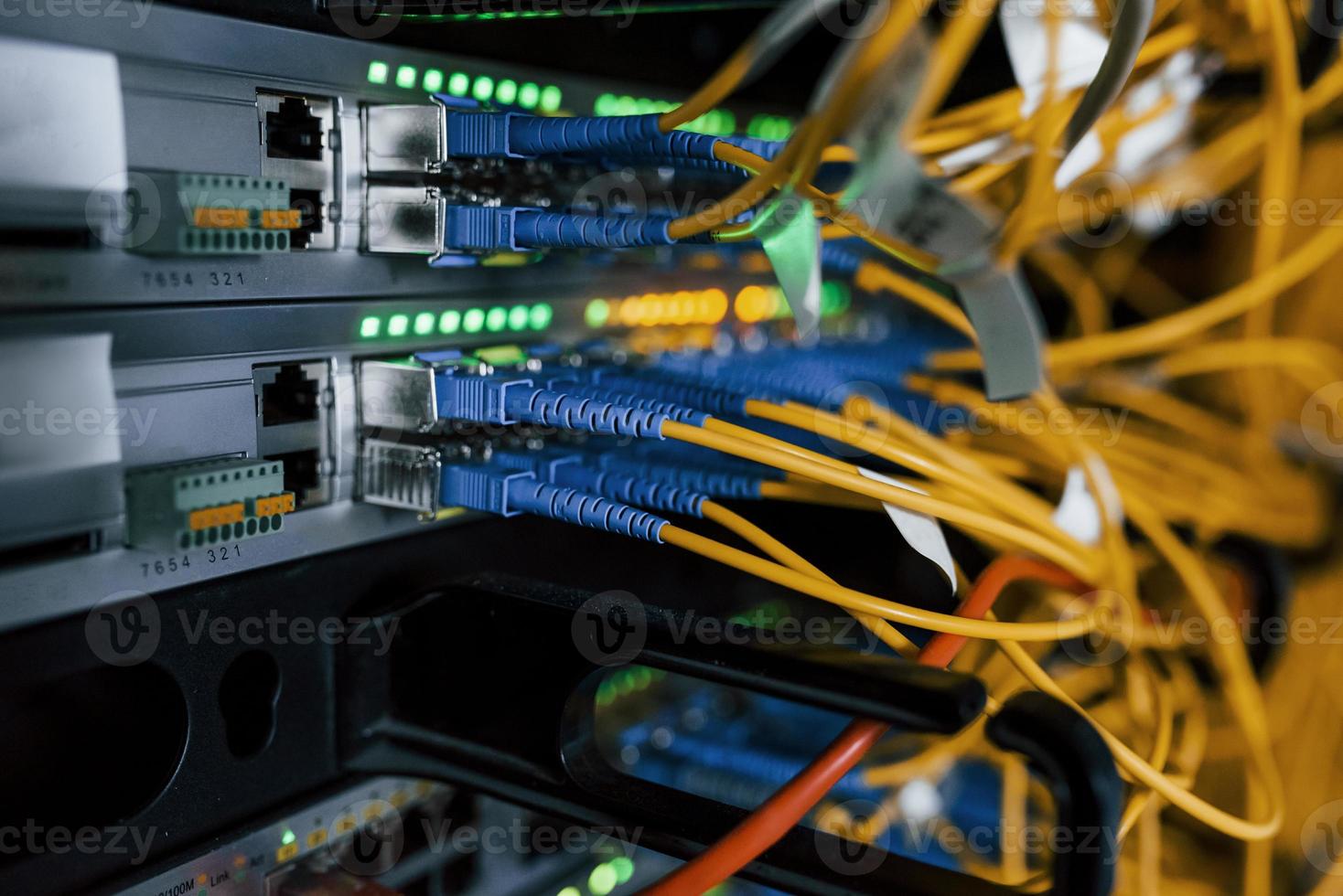 Close up view of internet equipment and cables in the server room photo