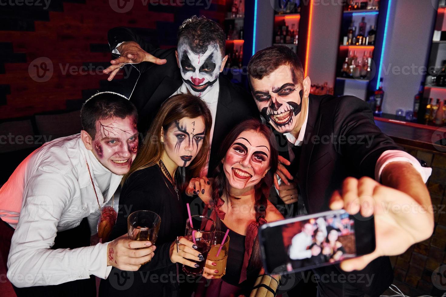 Friends is on the thematic halloween party in scary makeup and costumes photo