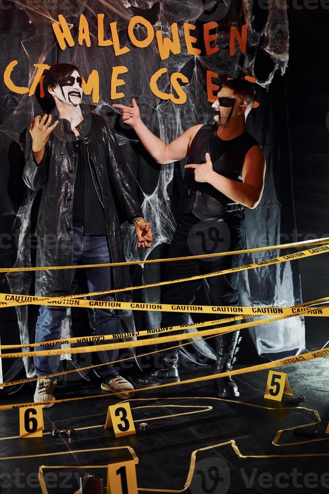 Black metal fans is on the thematic halloween party in scary makeup and costumes photo