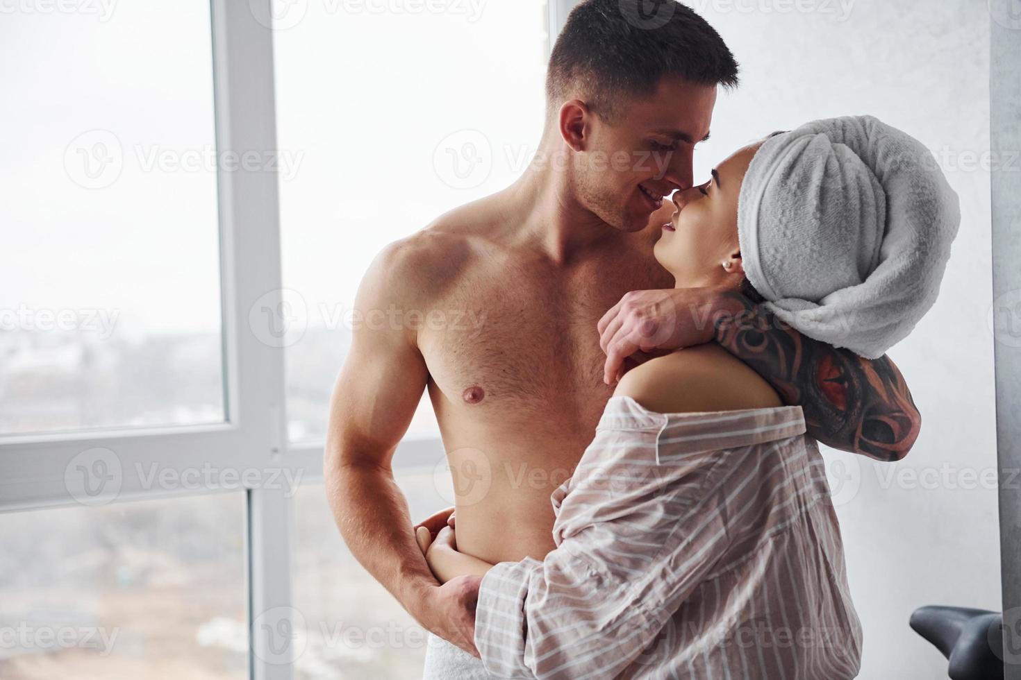 Couple at morning rime after the shower standing together photo