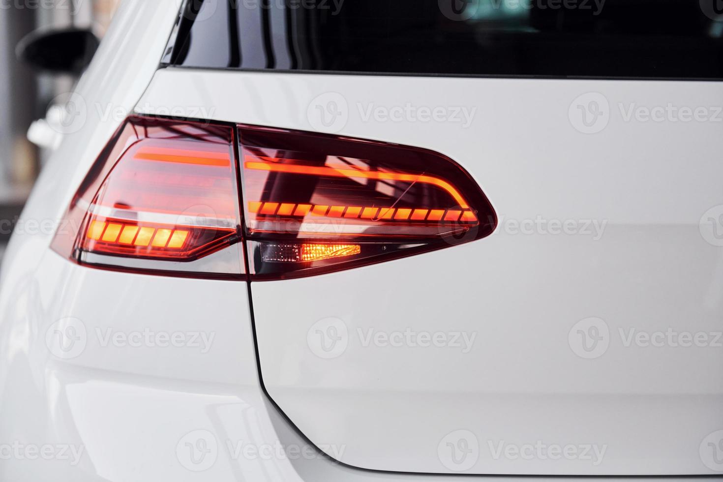 Close up view of brand new white colored polished automobile photo