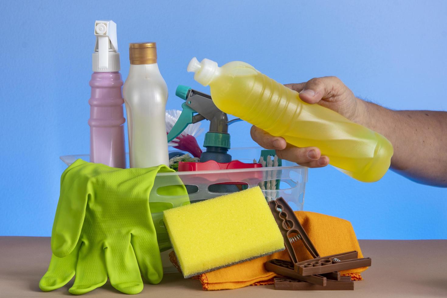 basket with cleaning products for home hygiene use photo