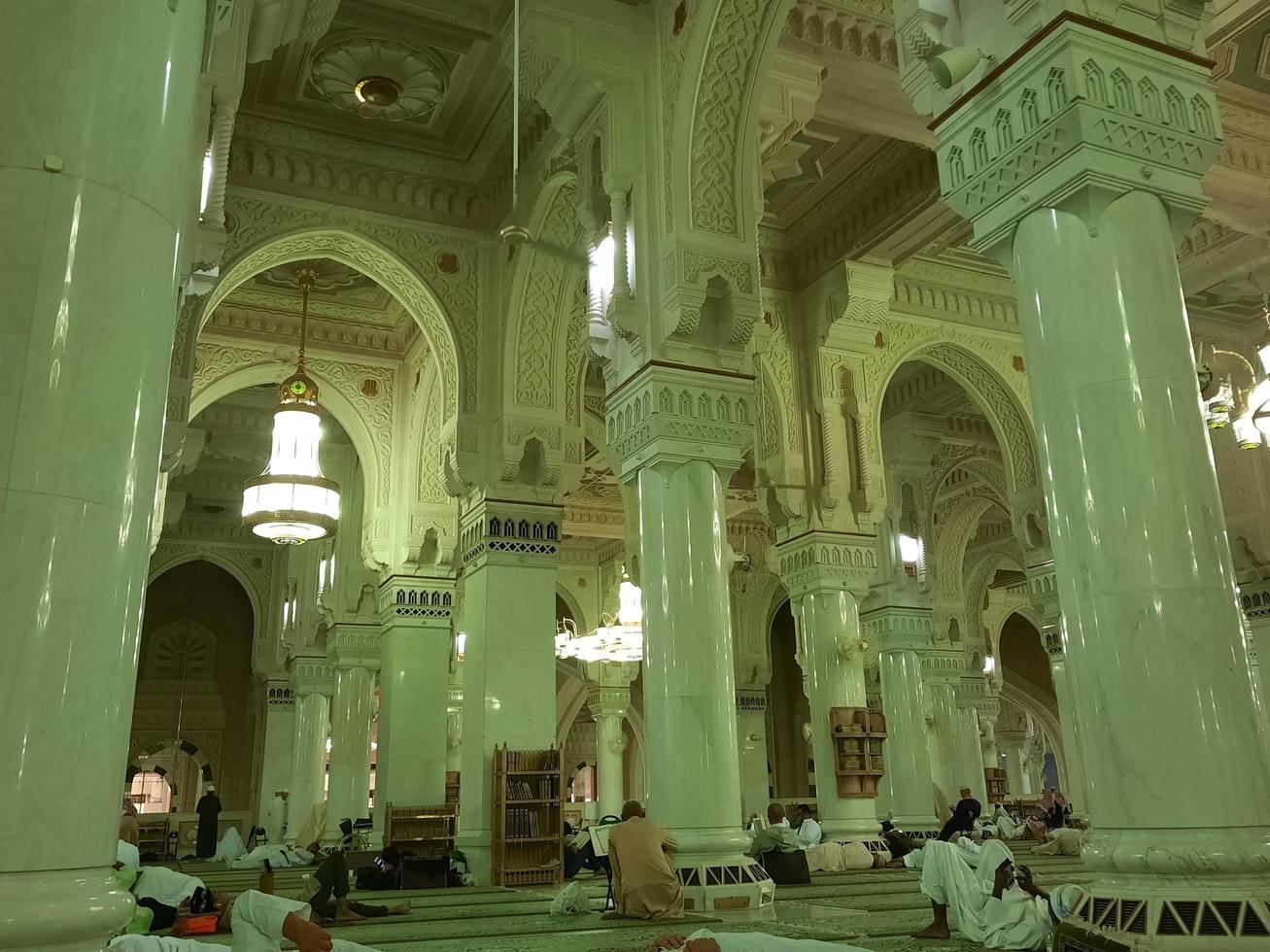 Mecca, Saudi Arabia, Nov 2022 - Beautiful view of decorative arches, pillars and chandeliers in the interior of Masjid al-Haram, Mecca, Saudi Arabia. photo