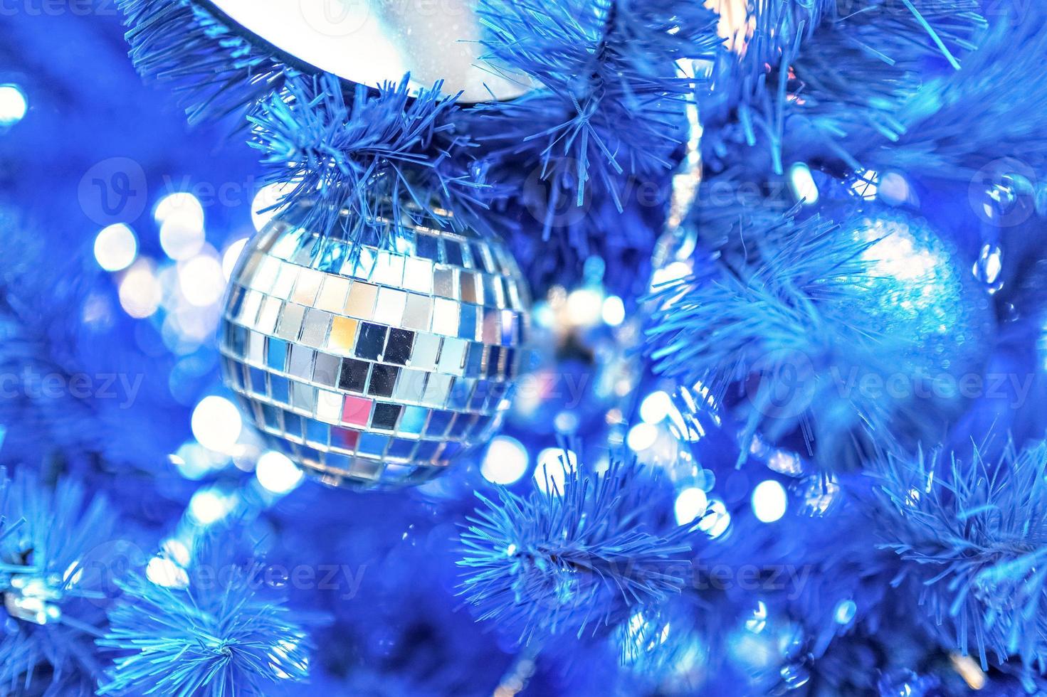 Christmas background of a Christmas tree decorated with Christmas toys.Winter holidays. New year. photo