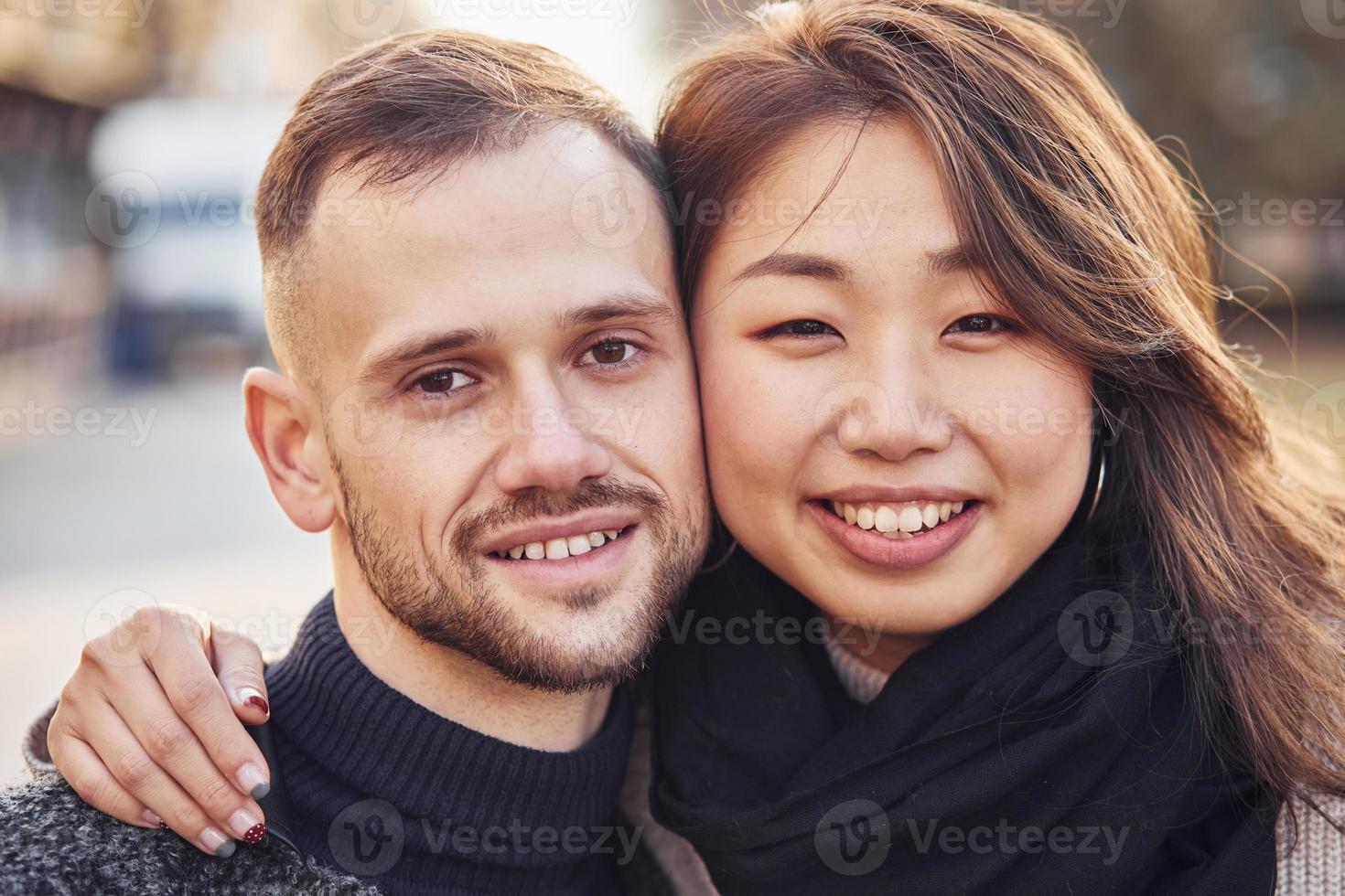 Portrait of multiracial couple. Asian girl with her caucasian boyfriend photo