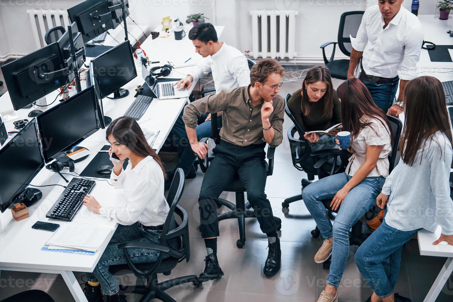 Young business people working together in the modern office photo