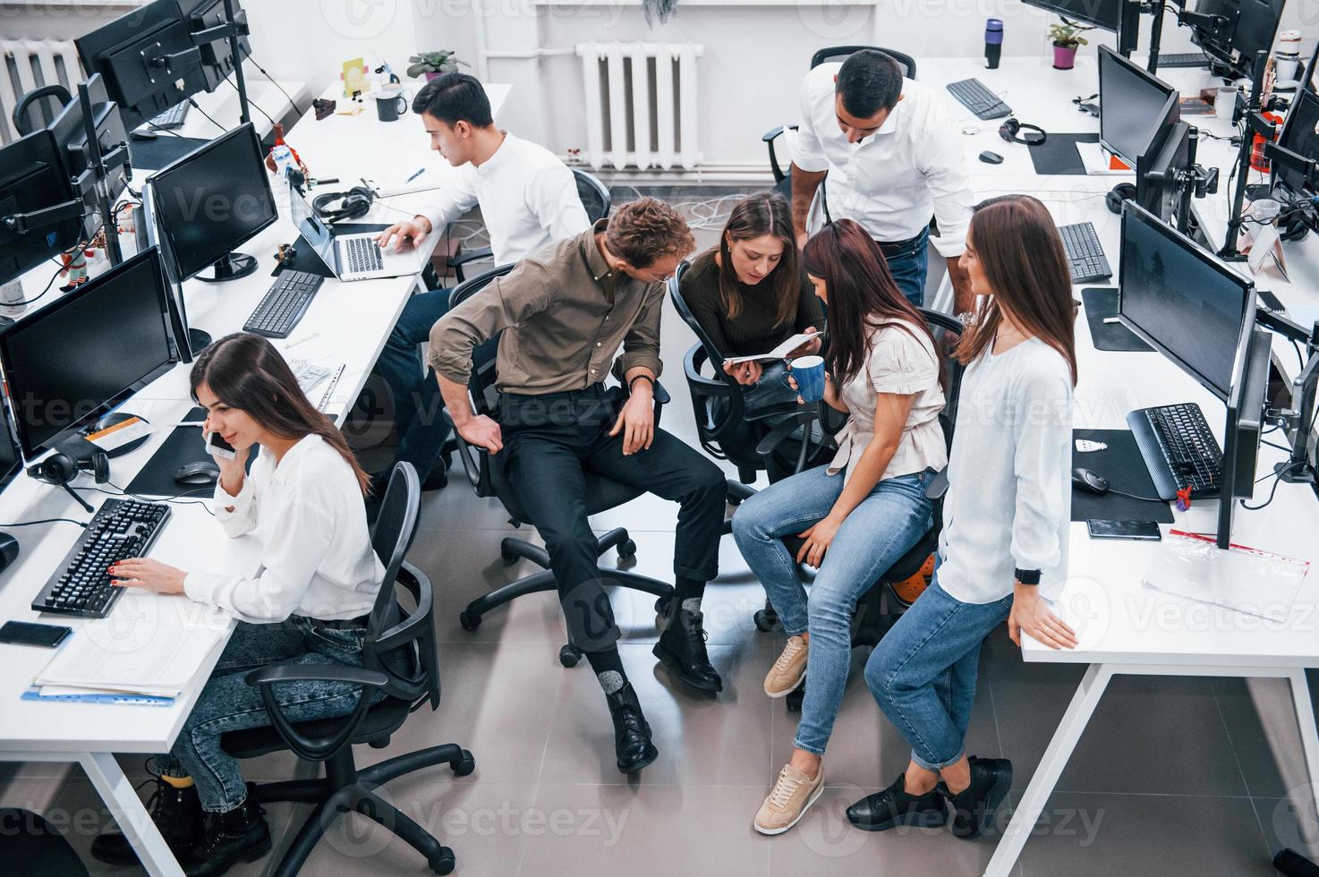 Young business people working together in the modern office photo