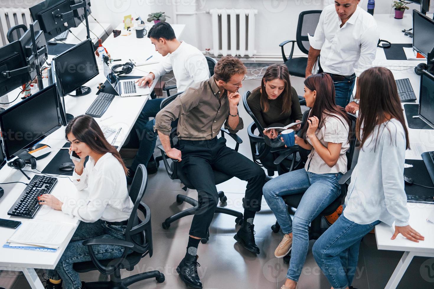 Young business people working together in the modern office photo