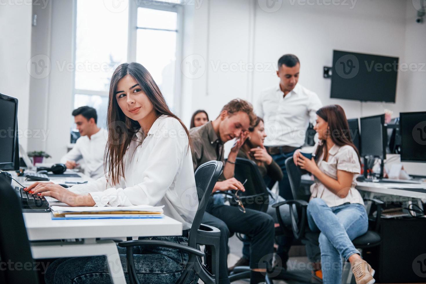 Young business people working together in the modern office photo