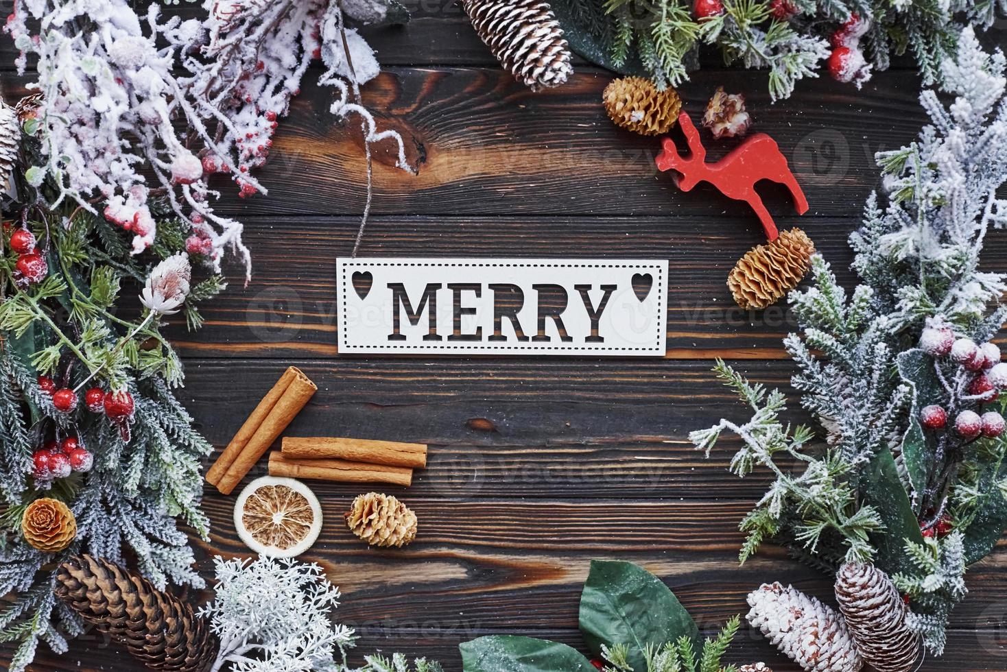 Table with merry word. Top view of christmas festive frame with new year decorations photo