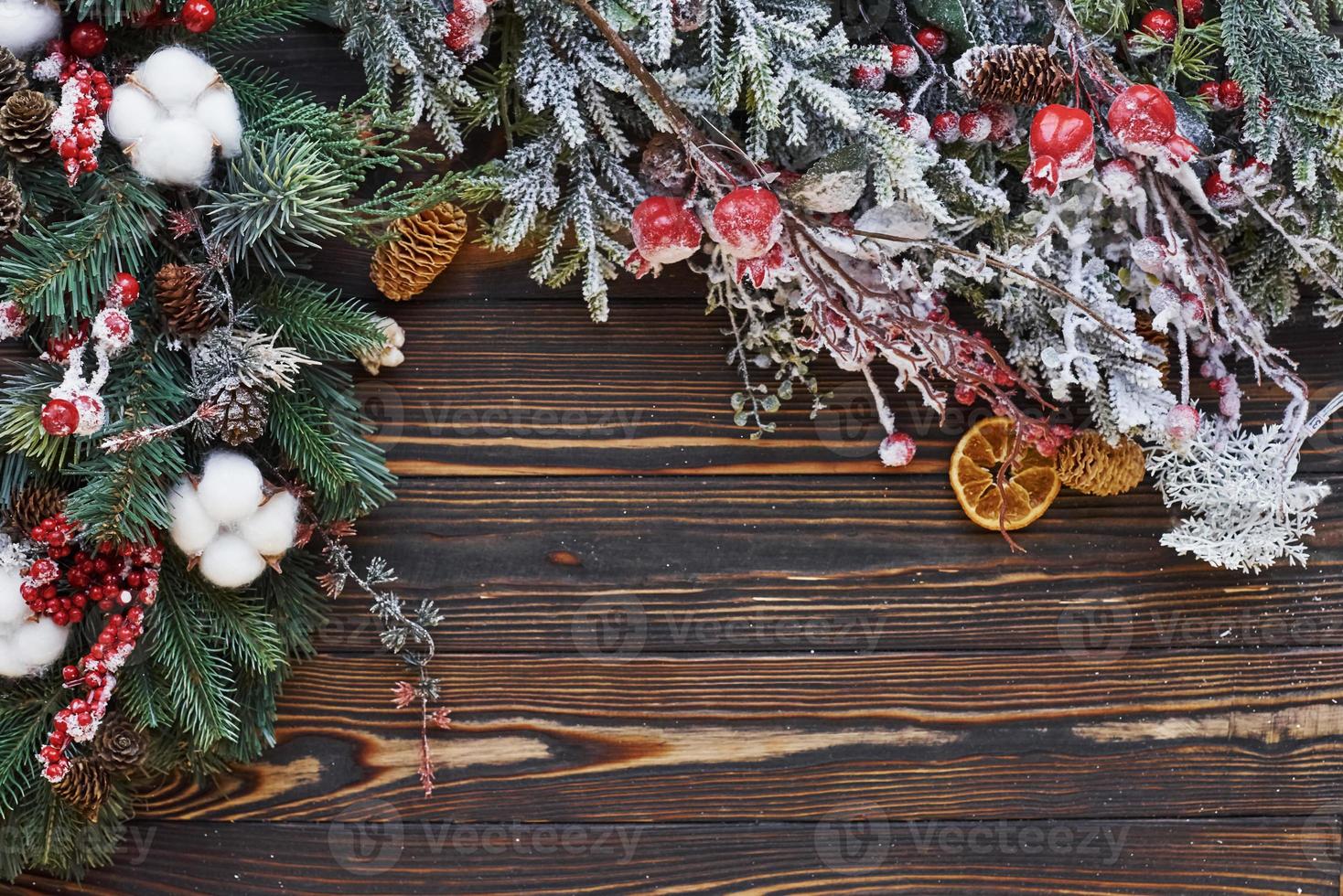 Green fir branches. Top view of christmas festive frame with new year decorations photo