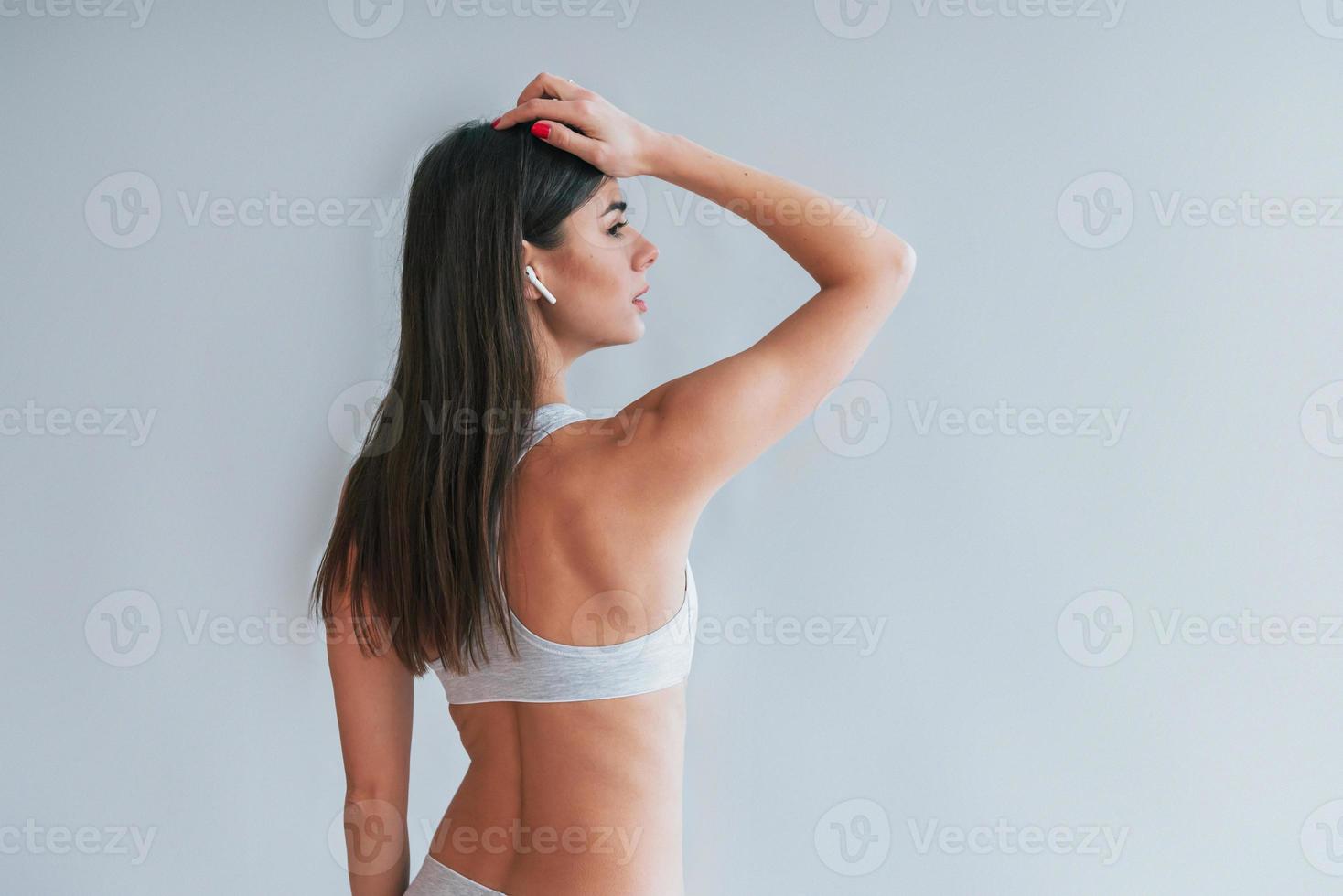 Foto de Cute little girl in underwear on white background do Stock