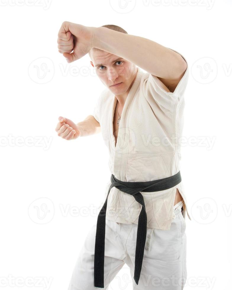 Karate. Man in a kimono photo