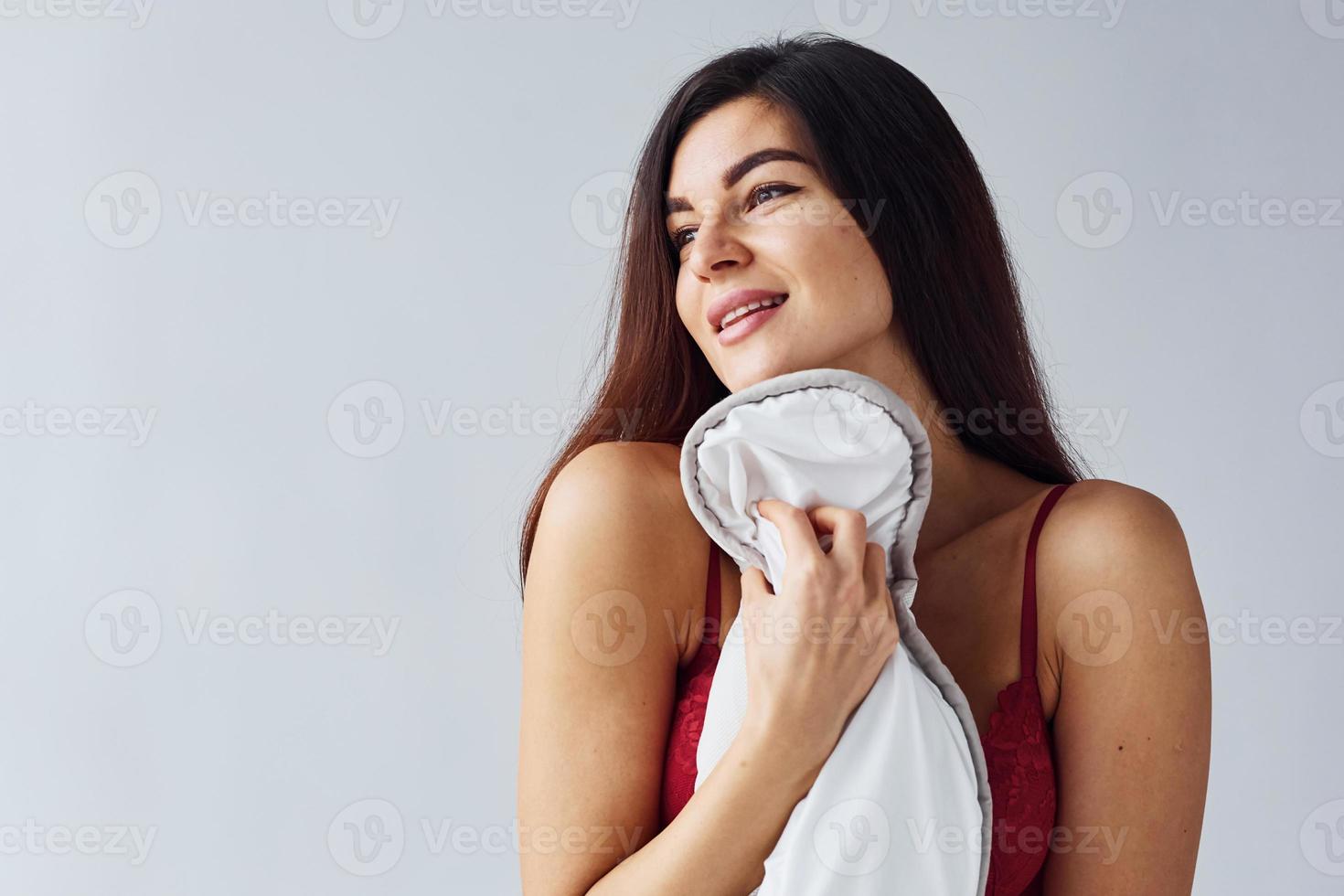 Woman in underwear in the studio against white background photo