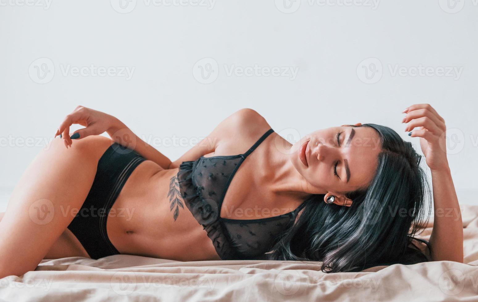 Sensual beautiful woman in a sensual underwear relaxing at home