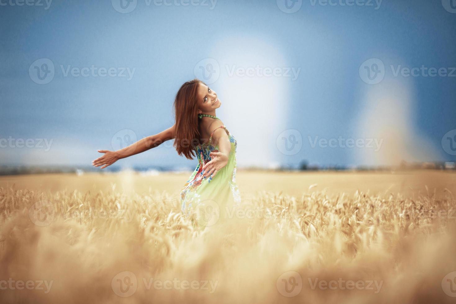 girl in wheat meadow photo