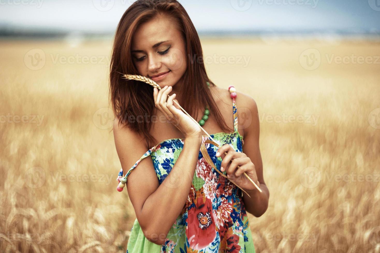 girl in wheat meadow photo