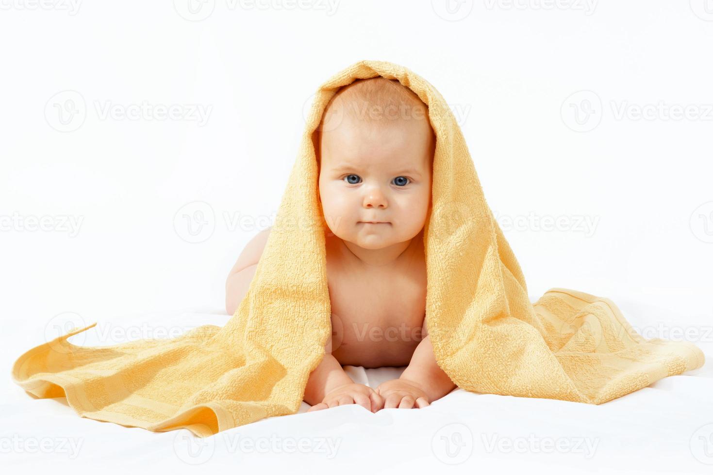 baby in yellow towel photo