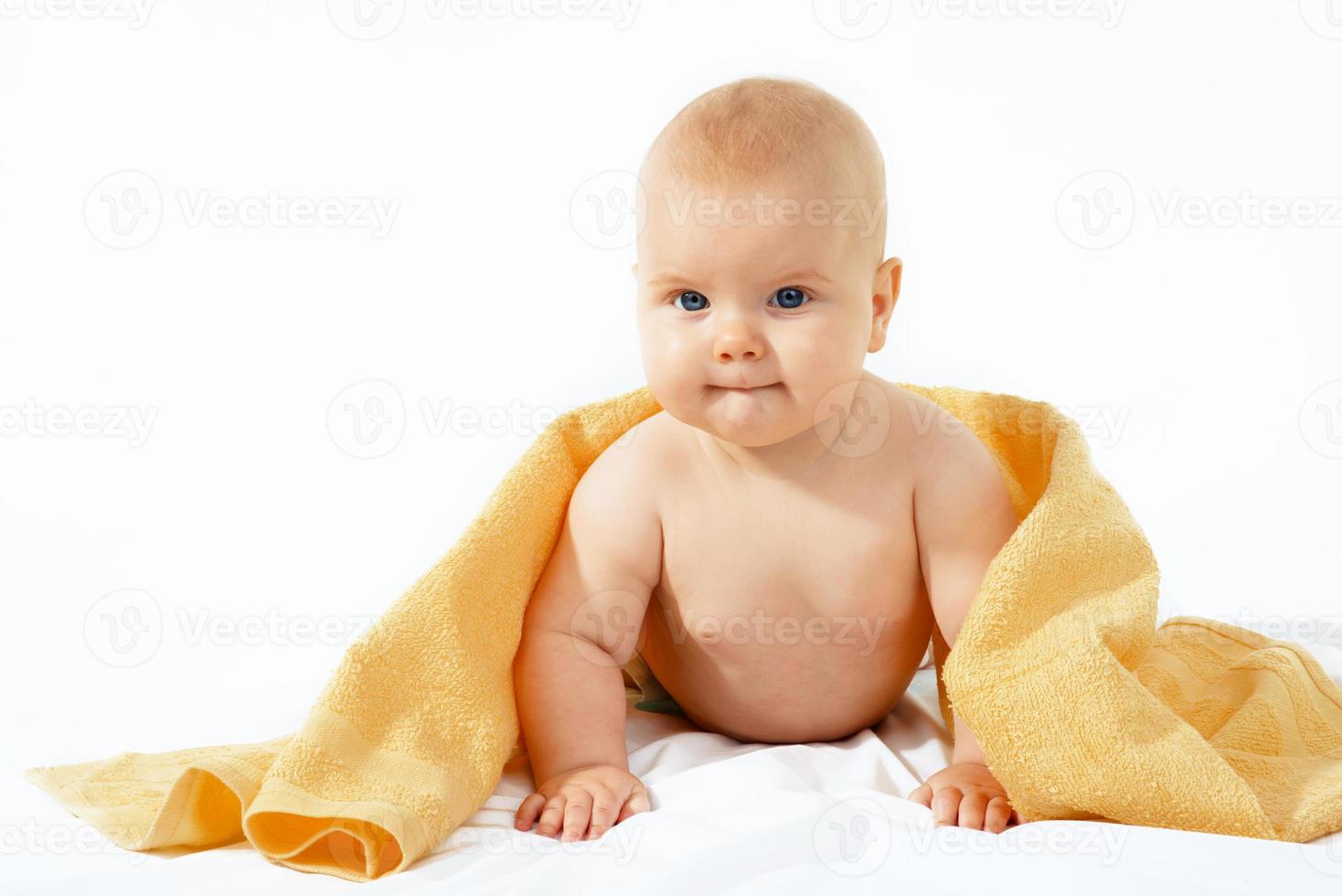 baby in yellow towel photo