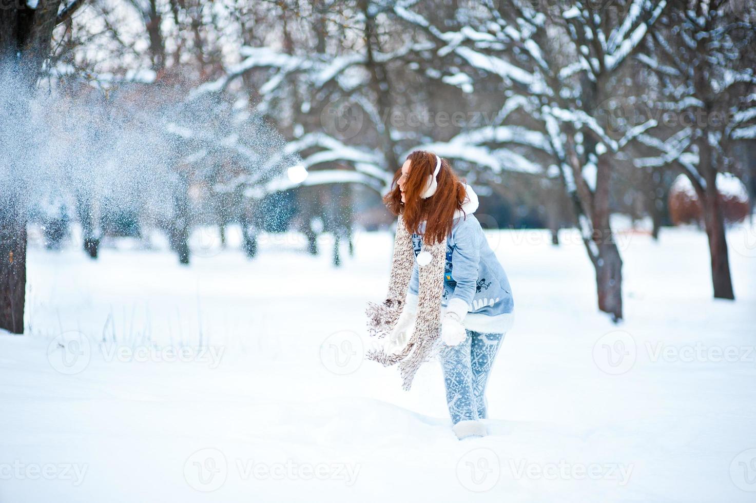 Girl in snowy forest photo