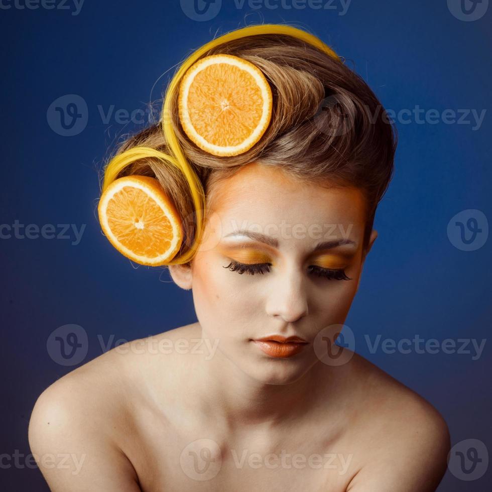 woman with fruit in hair photo