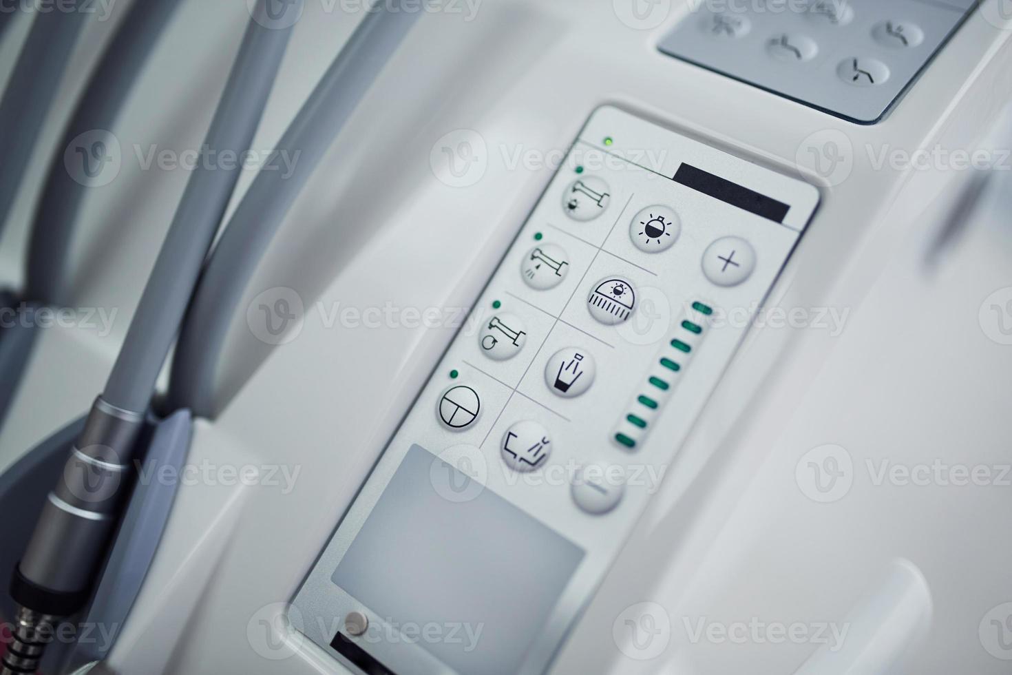 Close up view of medical chair's control panel with buttons photo