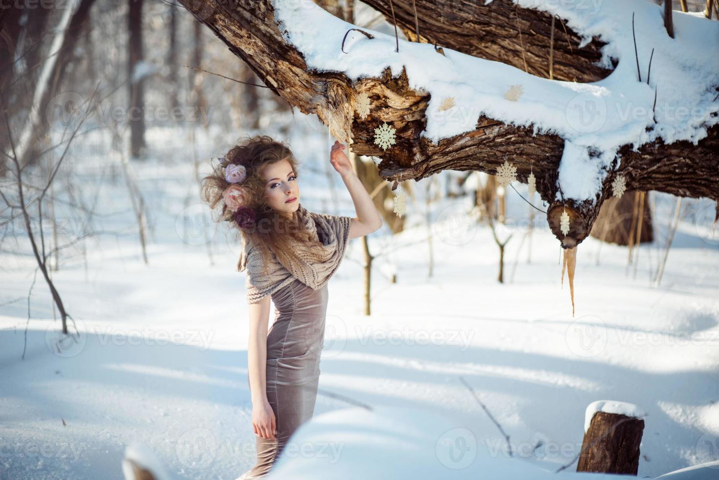 beautiful girl in the winter forest photo