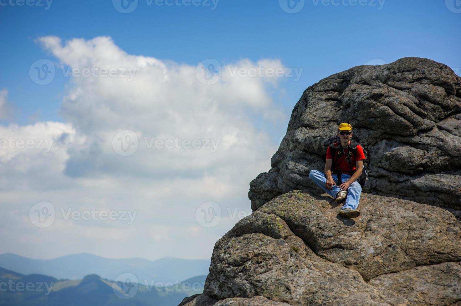 tourist on  rock photo