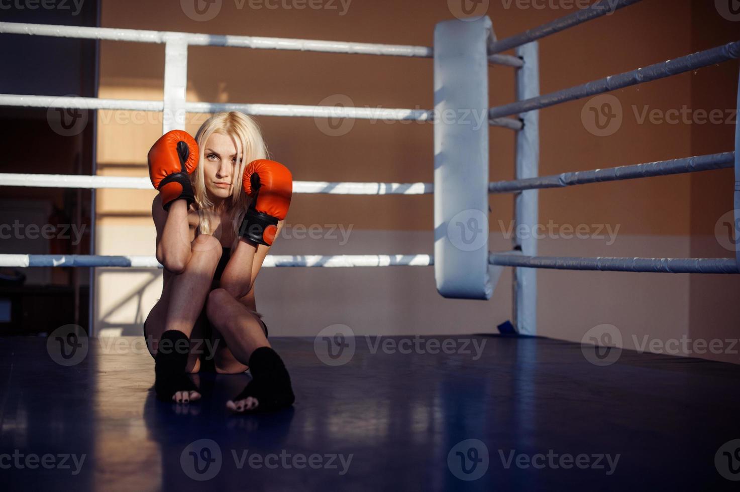 Pretty sport woman with boxing gloves photo