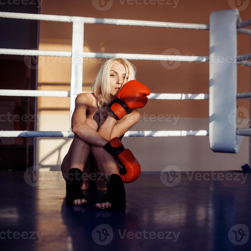 Pretty sport woman with boxing gloves photo