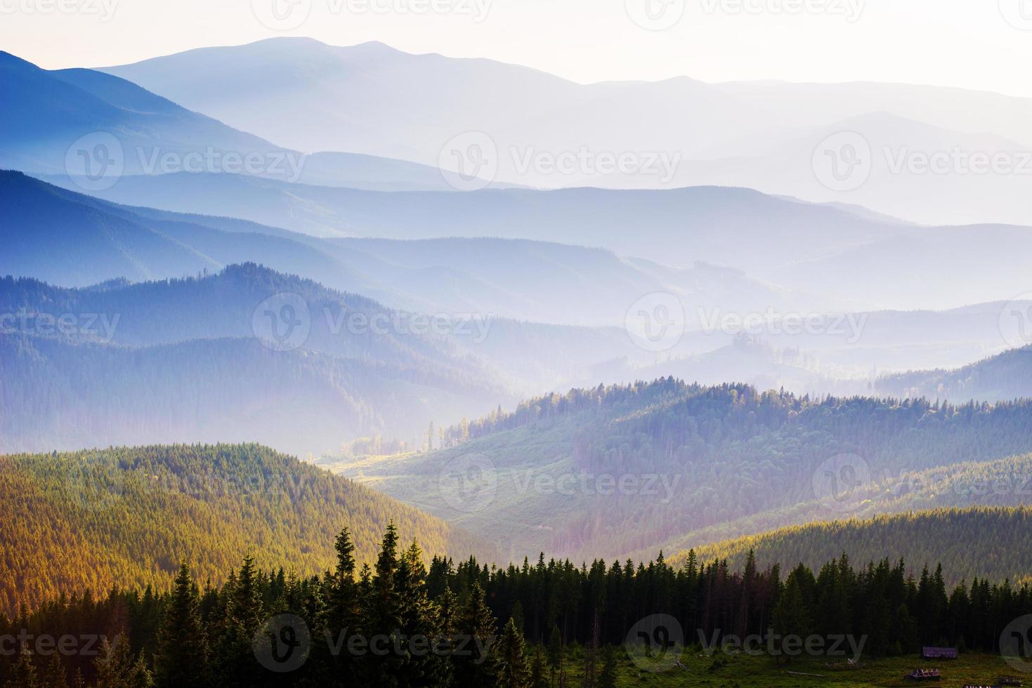 View of misty fog mountains in autumn photo