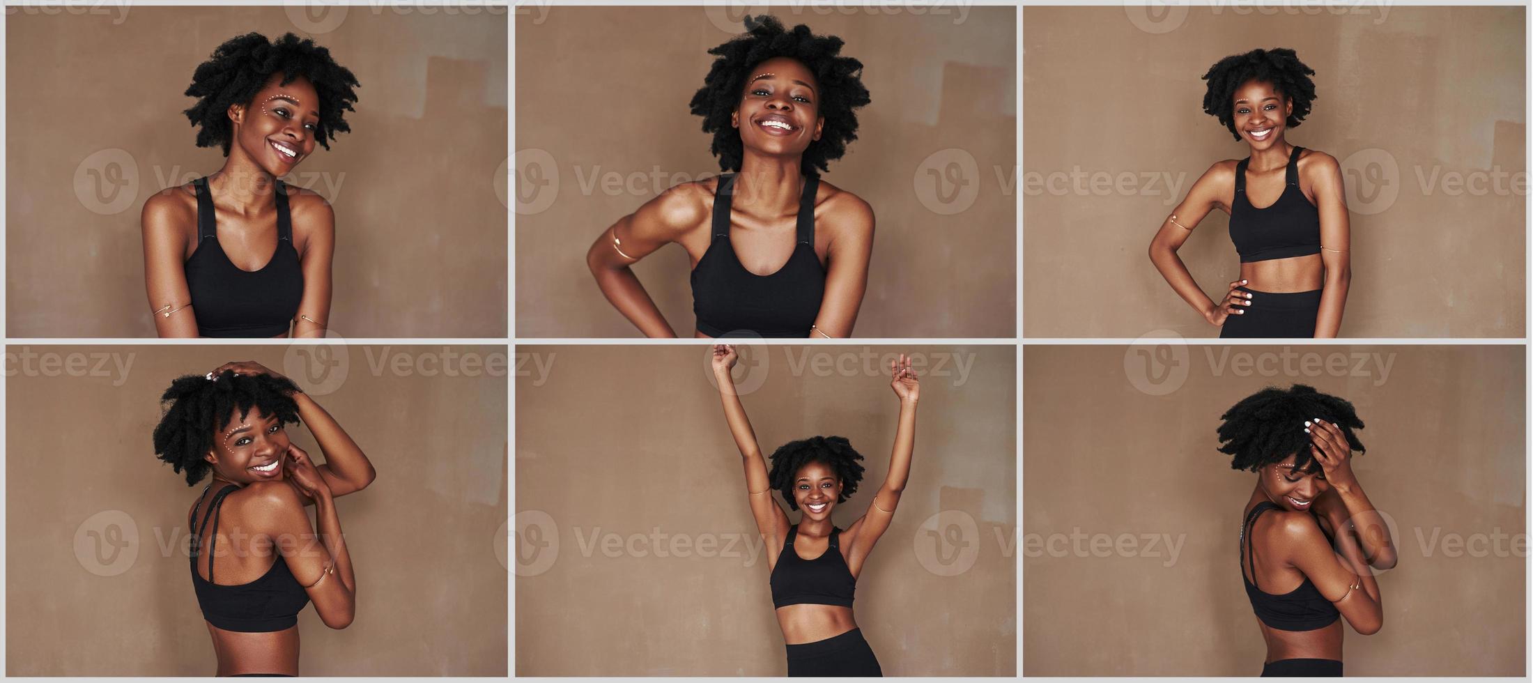 Feels great. Young beautiful afro american woman in the studio against brown background photo