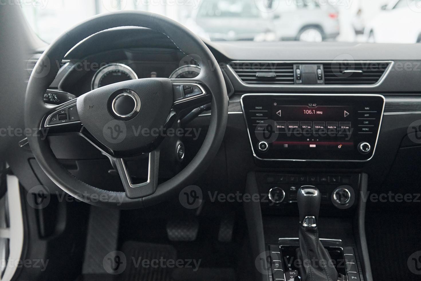 Front panel of brand new modern vehicle with digital tablet and control panel photo