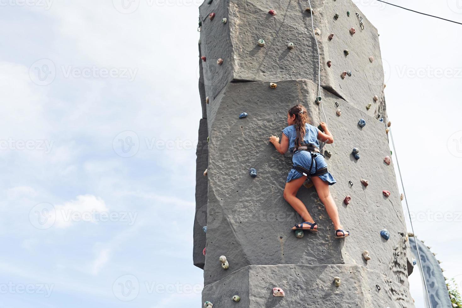 Little girl in casual blue clothes training rock climbing outdoors 15260756  Stock Photo at Vecteezy