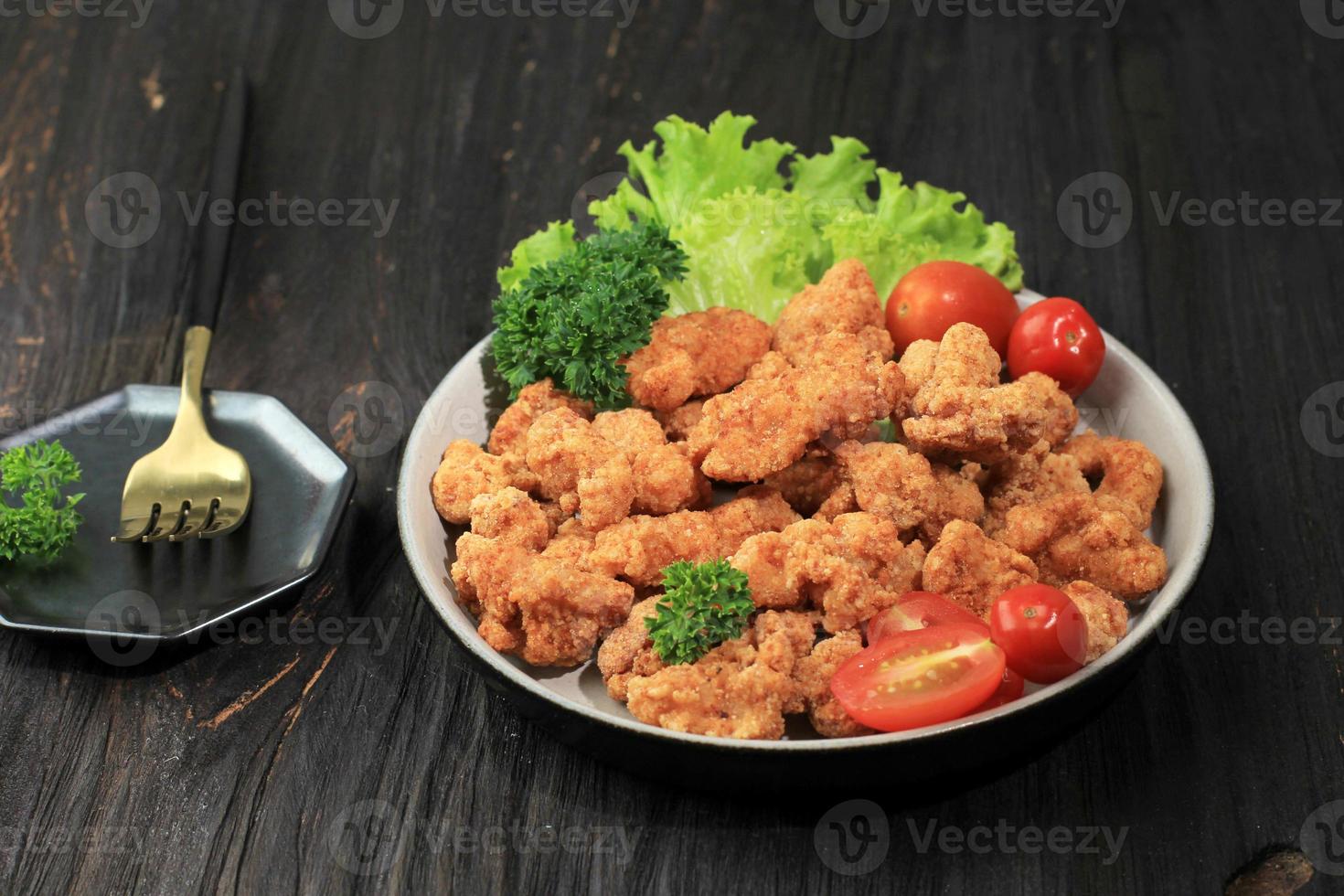 Chicken Popcorn, Small Slices of Chicken Coated with Breadcrumb and Deep Fried. photo