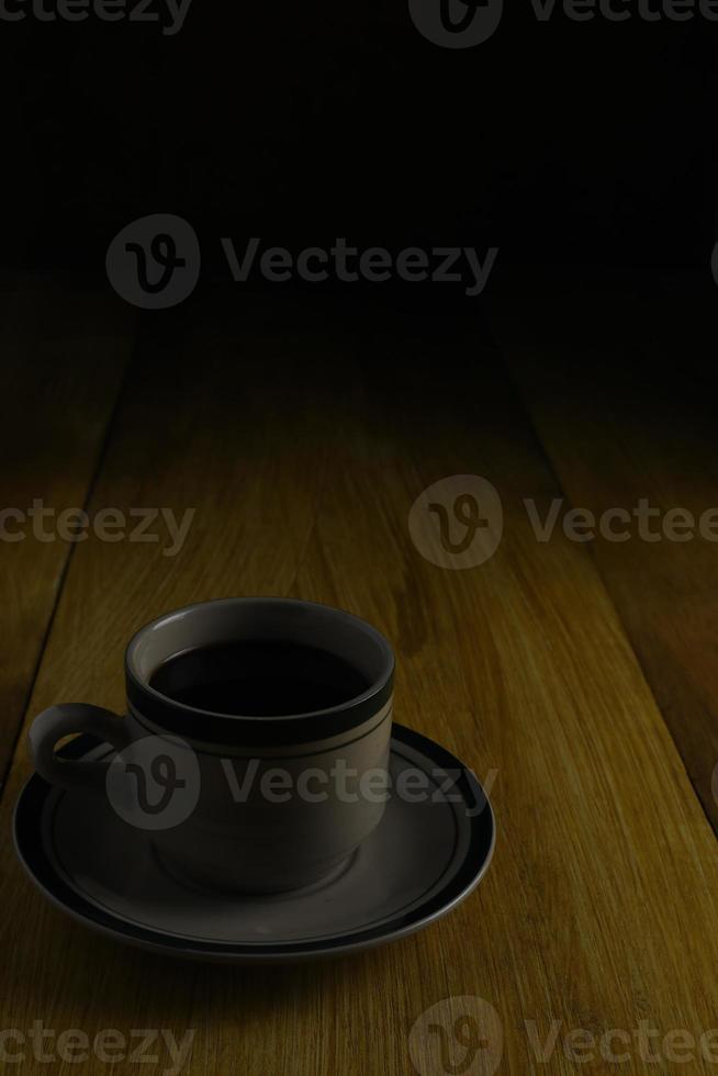 cup of black coffee on a wooden background. copyspace area photo
