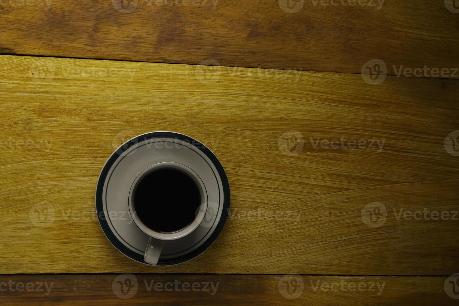 cup of black coffee on a wooden background. copyspace area photo