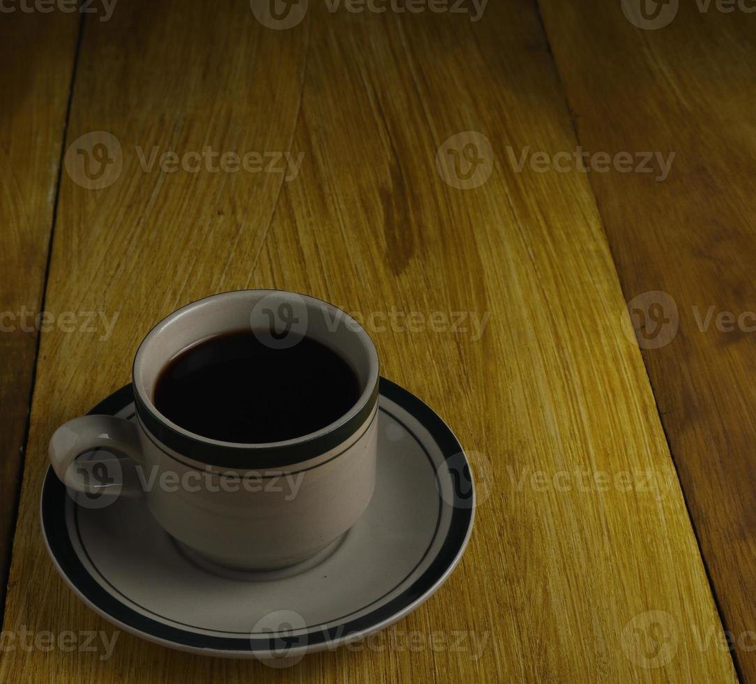 cup of black coffee on a wooden background. copyspace area photo