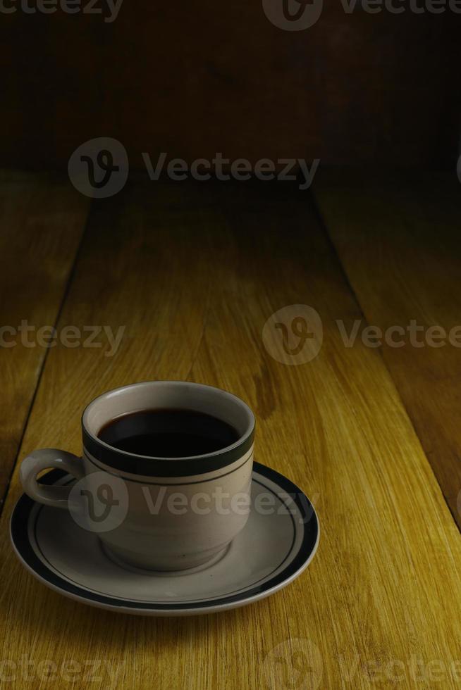 cup of black coffee on a wooden background. copyspace area photo