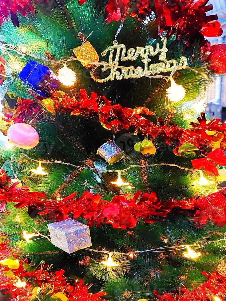Defocus blurred Christmas tree background. photo
